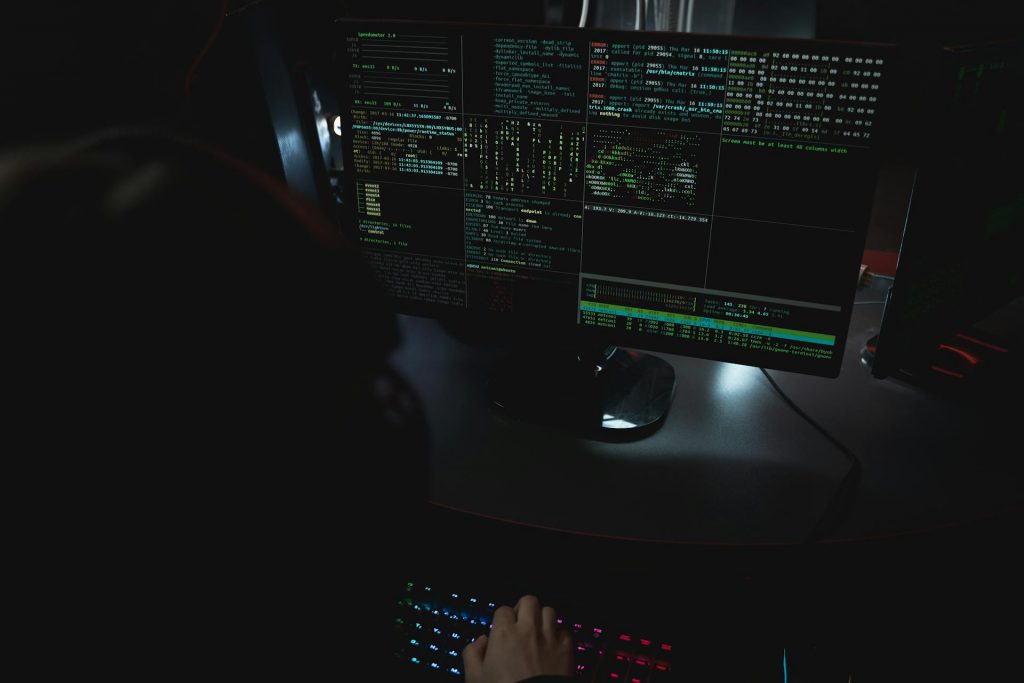 Cybersecurity student monitoring network activity and analysing security systems in Malaysia.